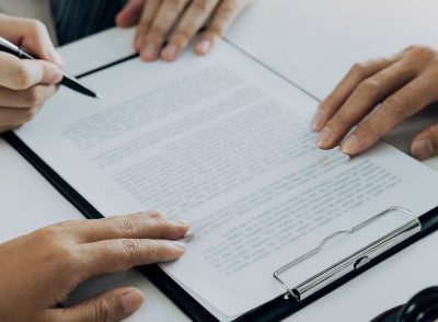 Couple is divorced who handed their engagement ring to the divorce documents that the lawyer was clarifying.
